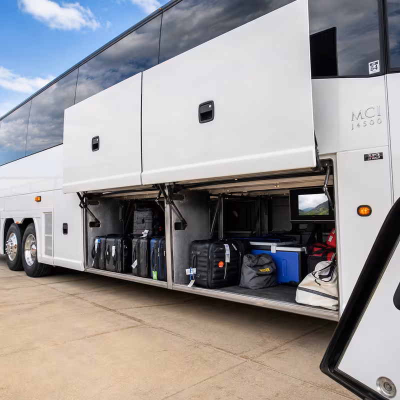 Party bus interior with wraparound leather seating and LED lighting in Anaheim