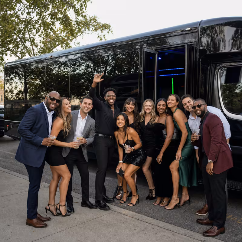 Group boarding a white charter bus for Birthday Transportation transportation in Anaheim