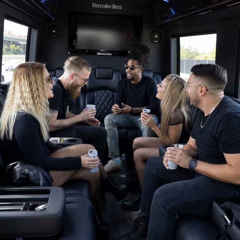 Group boarding a white charter bus for Concert Transportation transportation in Anaheim