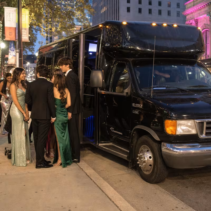 Passengers loading luggage while boarding an Anaheim group shuttle
