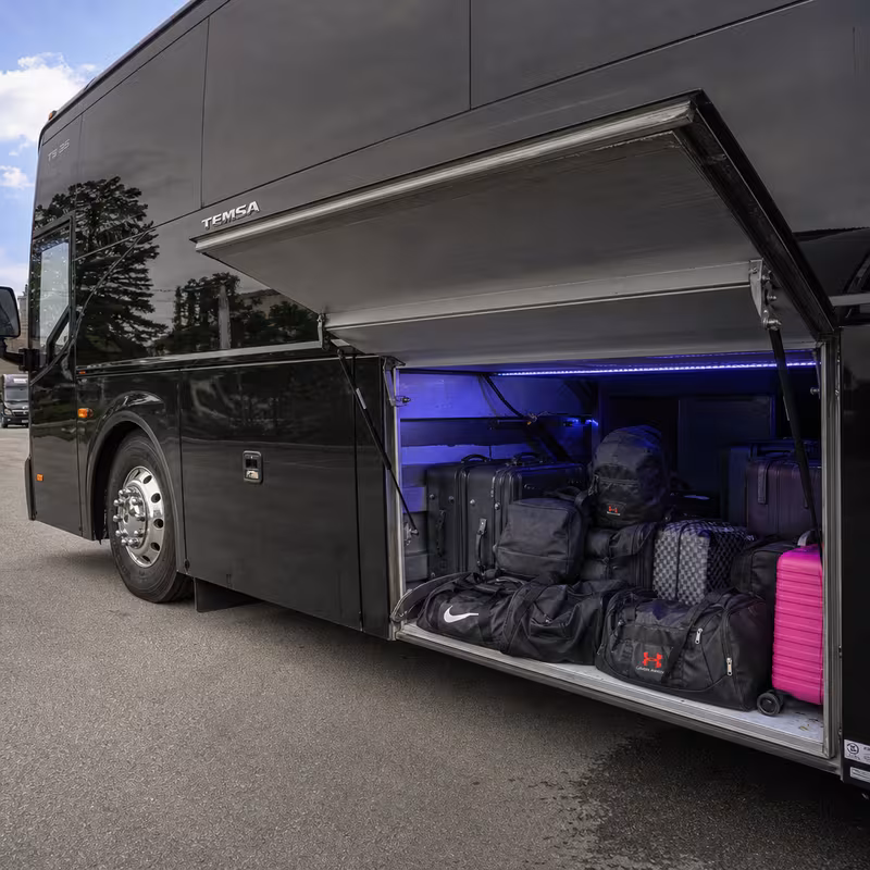 Party bus interior with wraparound leather seating and LED lighting in Anaheim