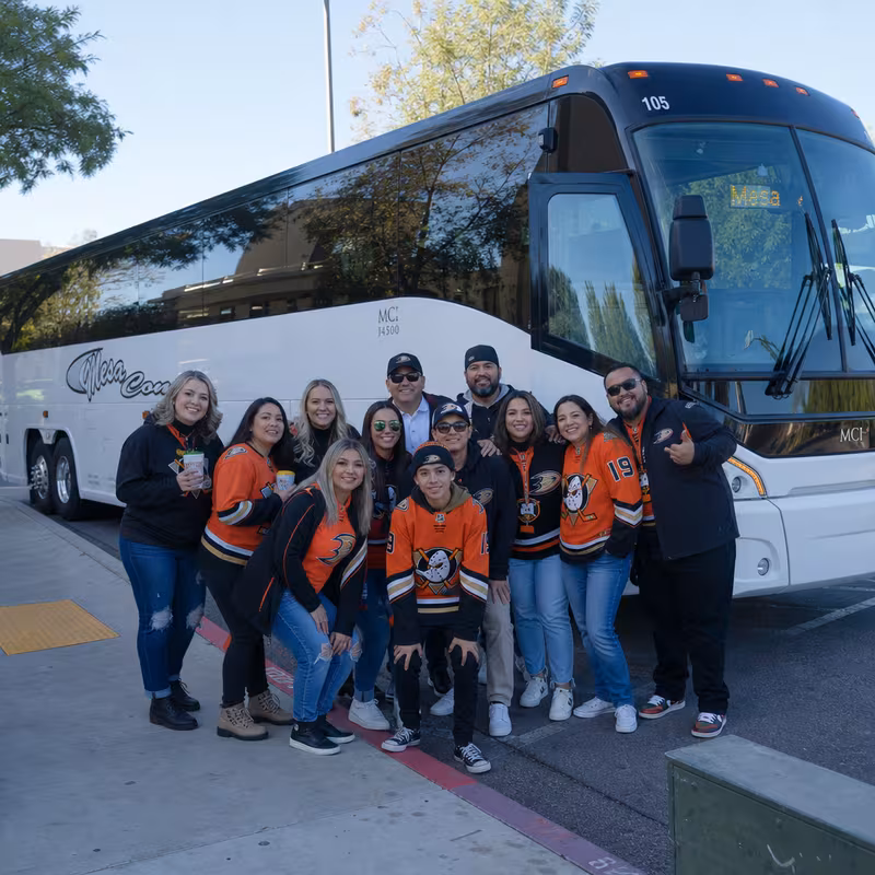 Passengers loading luggage while boarding an Anaheim group shuttle