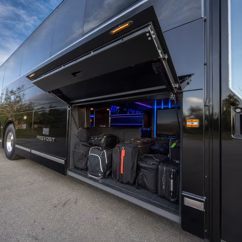 Party bus interior with wraparound leather seating and LED lighting in Anaheim